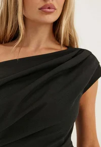 Draped asymmetric neckline of the Bubbleroom black maxi dress