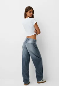 Back view of Bershka dark blue balloon baggy jeans