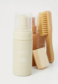 Close-up of UGG care bottles and tools