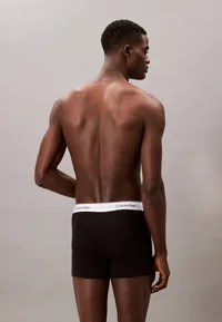 Calvin Klein black boxer briefs, rear model view