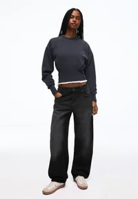 Bershka black balloon baggy jeans styled on model