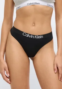Close-up of black Calvin Klein thong and logo waistband