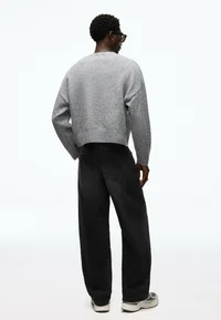 Bershka black baggy jeans, back view on model