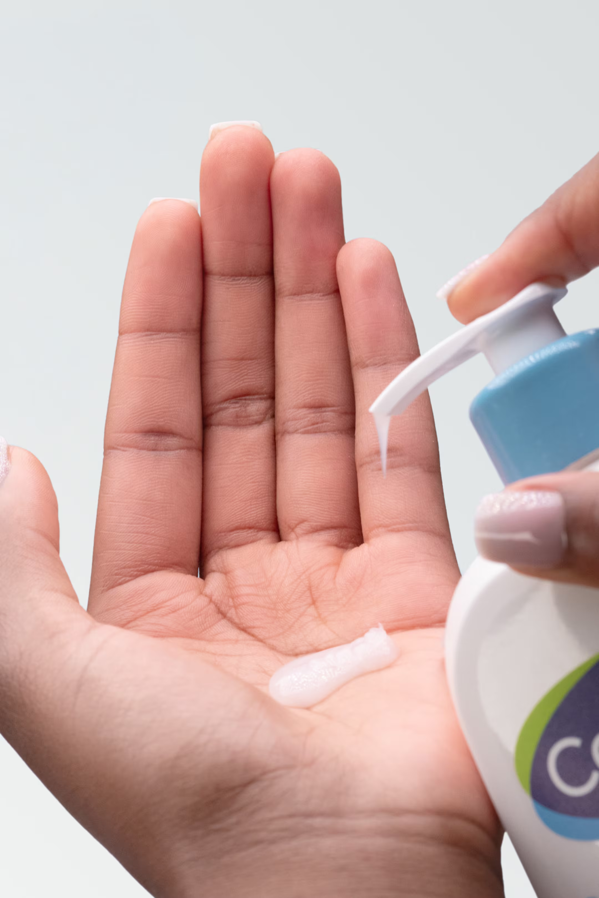Cetaphil Gentle Skin Cleanser dispensed into a hand
