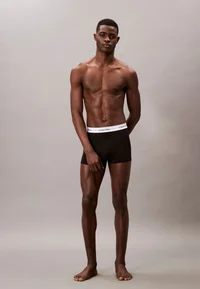 Calvin Klein black boxer briefs, full-length model view