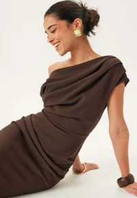 Bubbleroom brown asymmetric maxi dress on seated model