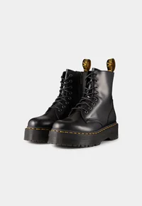 Pair of Dr. Martens Jadon black platform boots, angled view