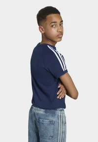 adidas Originals Night Indigo T-shirt worn by a boy, rear side view