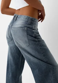 Back pocket detail of Bershka dark blue jeans