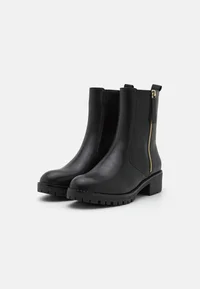 Pair of Anna Field black faux leather ankle boots