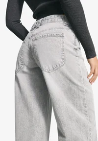 Back pocket detail of Bershka grey jeans